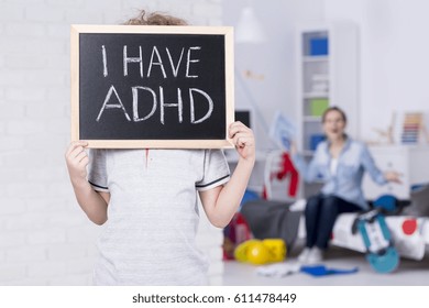 Boy Holding Blackboard And Admitting Suffering From ADHD