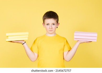 Boy Holding Books On Hands As A School Punishment. Child Choosing Subject To Study