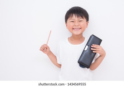 Boy Holding A Pencil And A Pencil Case