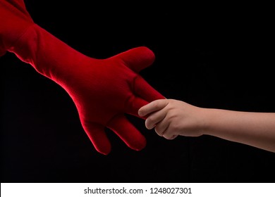 Boy Holding Red Soft Toy Fingers, Imaginary Friend Concept. Trust, Affection And Happiness