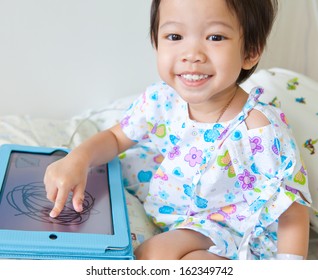 Boy In Hospital With Tablet