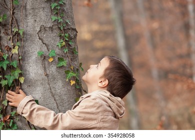 Boy Hugging A Tree