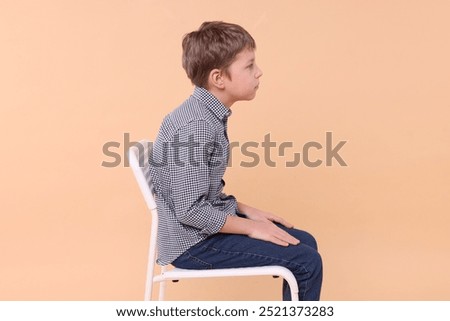 Similar – Image, Stock Photo Preteen boy sitting at table and eating fresh cut musk melon