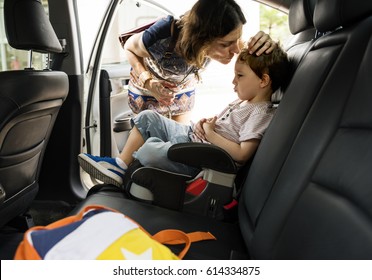 Boy Into The Car Using Carseat Protect Security