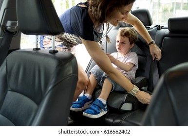 Boy Into The Car Using Carseat Protect Security