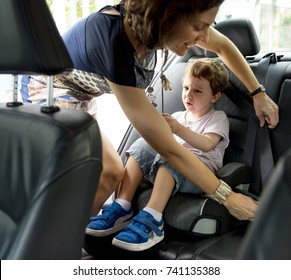 Boy Into The Car Using Carseat Protect Security