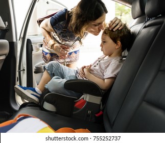 Boy Into The Car Using Carseat Protect Security