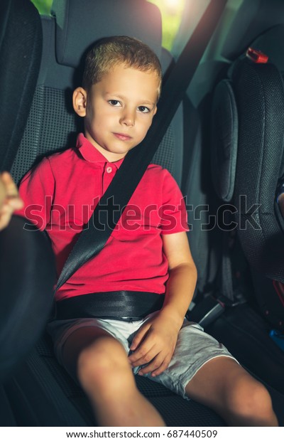 Boy into the Car Using Seat\
belt