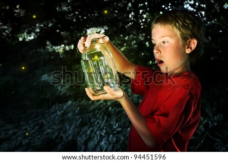 Boy with a jar of fireflies