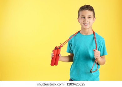 Boy With Jump Rope On Color Background. Space For Text