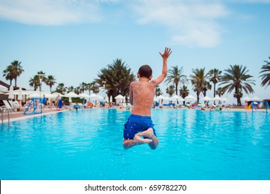 Boy Jumping In Pool