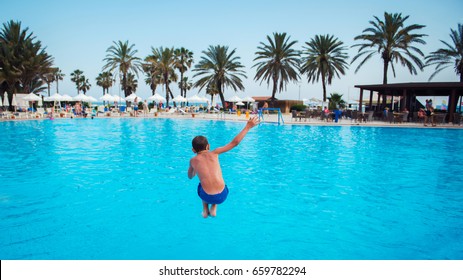 Boy Jumping In Pool