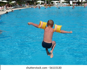 Boy Jumping In Swimming Pool