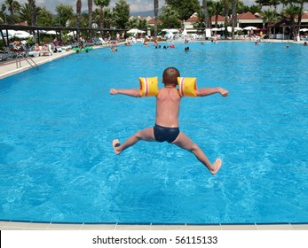 Boy Jumping In Swimming Pool