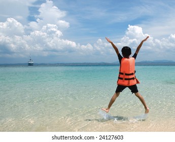 A boy jumps with a life jacket - Powered by Shutterstock