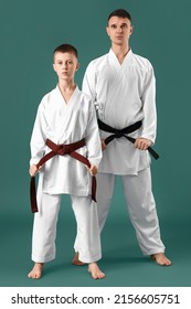 Boy With Karate Instructor On Green Background