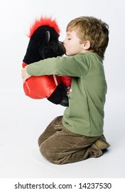 Boy Kissing Toy Gorilla