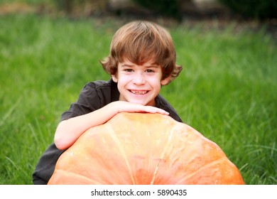 Boy and Large Pumpkin