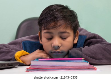 a boy laying down on table and Sleeping