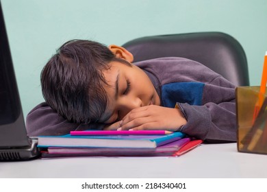 a boy laying down on table and Sleeping