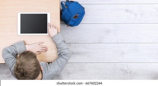 boy learning with tablet pc. Top view header