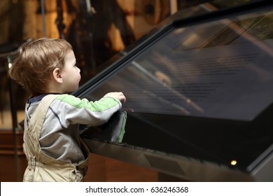 Boy Learning Touch Screen In A Museum