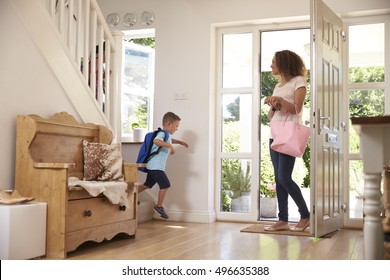 Boy Leaving Home For School With Mother