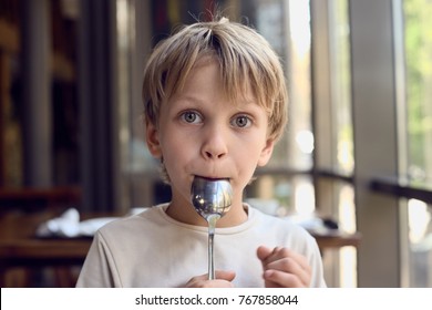 Boy Licking Spoon