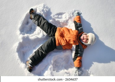 boy lies on north pole snow