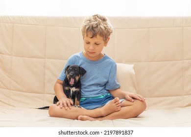 A Boy With A Little Dog Doing Yoga