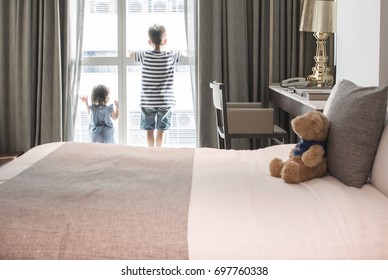 The Boy And Little Girl Were Waiting For Something By The Window In The Bedroom.