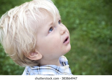 Boy Looking To His Father, Asking For Permission.