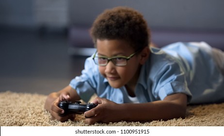 Boy Looking At Screen While Playing Video Game, Health Harm, Sedentary Lifestyle