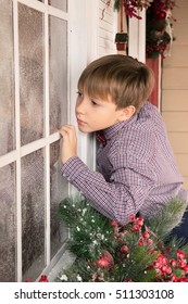 Boy Looking Through Frosted Window, Christmas Decoration 