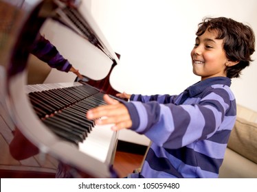 Boy looking very excited about taking piano lessons