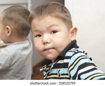 boy looks at the camera