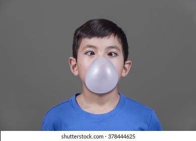 Boy Looks Down At Bubble Gum.