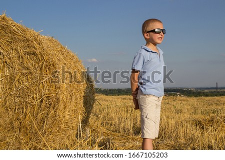 Similar – Vater und Sohn sitzen im Park.