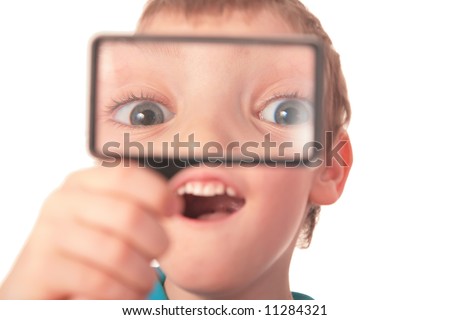 Similar – Child with reading magnifier