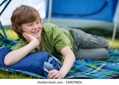 Boy Lying On Sleeping Bag