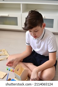 A Boy Makes A Bird Feeder.