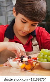 Boy Making Fruit Salad