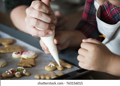 Boy Making Gingerbread Cookies With His Mum
