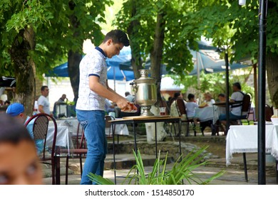 A Boy Making A Samovar Tea In A Cafe In Sheki. 19.07.2019 Sheki. Azerbaijan