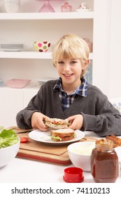 Boy Making Sandwich In Kitchen