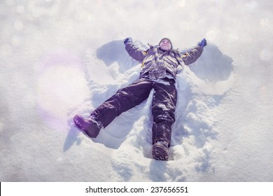 Boy Making A Snow Angel