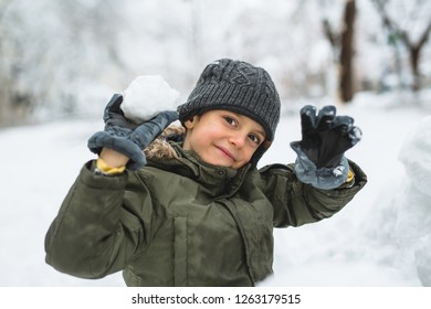 Boy Making Snowball Outdoor