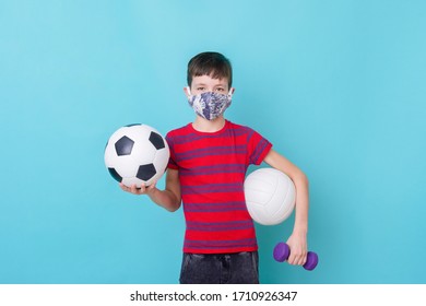 Boy with a mask due to the corona virus play on blue background. Workout online concept. - Shutterstock ID 1710926347