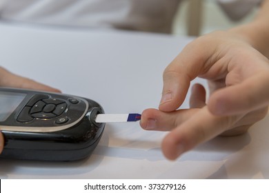 Boy Measure Glucose Or Blood Suger Level