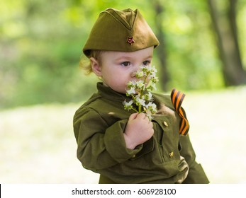 Boy In Military Uniform On Holiday Day Of Victory, May 9, Russia